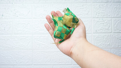 Ketupat (rice dumpling) on white wall. Ketupat is most popular food on Aidilfitri festival