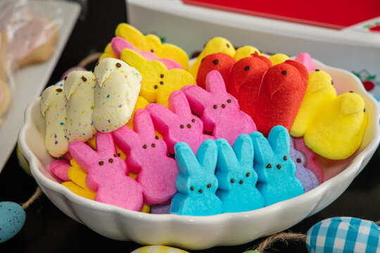 A bowl with Peeps flavored marshmallow bunnies and chicks at a dessert's table. San Diego, CA USA on April 4, 2021.