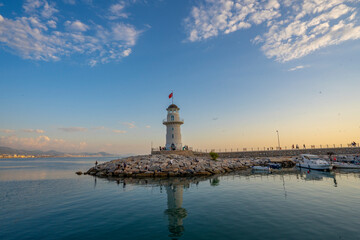 Fototapeta na wymiar A wonderful lighthouse at sunset on the Mediterranean coast