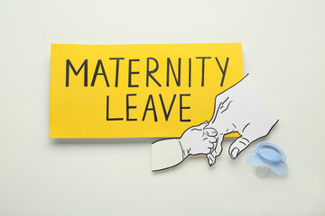 Note with words Maternity Leave, baby pacifier and paper cutout of hands on white background, flat...