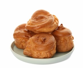 Pile of delicious profiteroles on white background