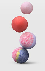 Many different bath bombs falling on white background