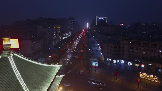 Night flight up Beida St past Bell Tower in Xian China, street traffic