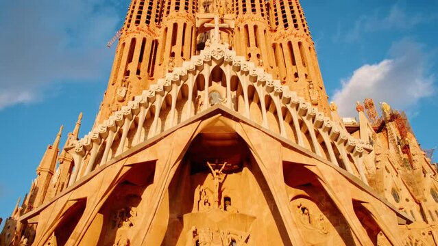 The Sagrada Familia basilica in Barcelona, Spain, the masterpiece of Antoni Gaudi, radiates in beautiful golden tones during sunset