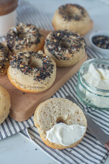 home made whole grain Bagels with cheese on a table