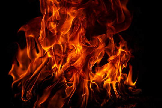 Fire blaze flames on black background. Fire burn flame isolated, abstract texture. Flaming explosion with burning effect. Fire wallpaper, abstract art pattern with copy space.