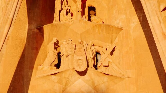 The Sagrada Familia basilica in Barcelona, Spain, the masterpiece of Antoni Gaudi, radiates in beautiful golden tones during sunset