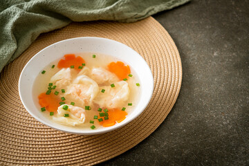 shrimp dumpling soup in white bowl
