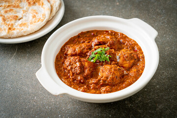 chicken tikka masala spicy curry meat food with roti or naan bread