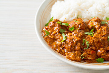 chicken tikka masala with rice on plate