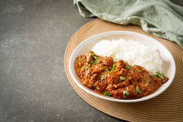 chicken tikka masala with rice on plate