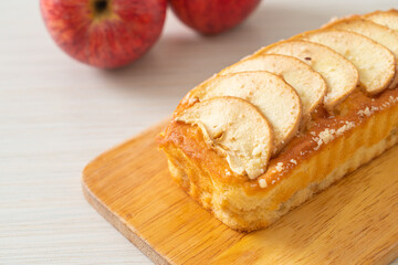 apple loaf crumbled on wood board