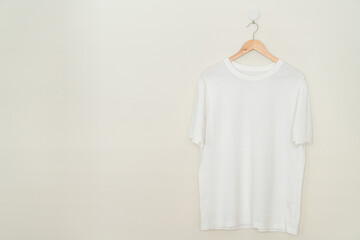 t-shirt hanging with wood hanger