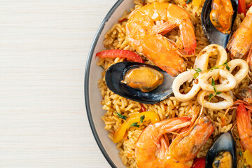 Seafood Paella with prawns, clams, mussels on saffron rice
