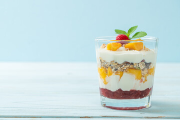 homemade mango and raspberry with yogurt and granola