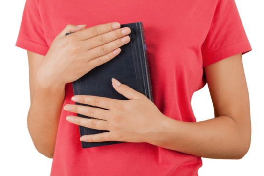 Woman in red shirt holding book isolated on white background