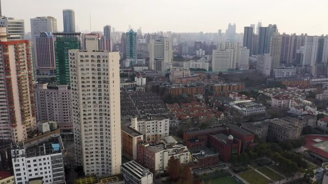 Aerial Drone Shot of Shanghai Skyline During Day Showing Empty Street and City Before Covid-19 Lockdown in Winter