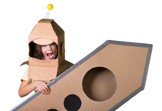 Child with rocket is dressed in an astronaut costume