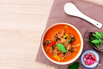 Beef curry, beef panang recipe. Thai food, young coconut milk curry Placed on a wooden table - top view