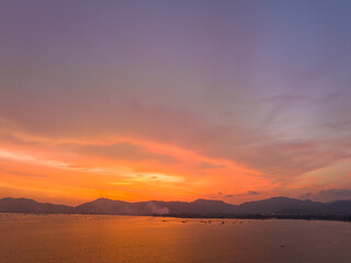 .aerial view stunning sky in sunset above the sea..colorful cloud in bright sky of sunset above the ocean at Khao Khad Phuket. .Majestic sunset or sunrise landscape Amazing ligh