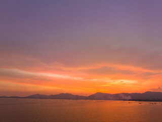 .aerial view stunning sky in sunset above the sea..colorful cloud in bright sky of sunset above the ocean at Khao Khad Phuket. .Majestic sunset or sunrise landscape Amazing light of nature 