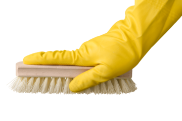 Yellow cleaning glove with a brush against a white background. Housewife work. Objects for cleaning the house.