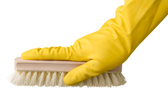 Yellow cleaning glove with a brush against a white background. Housewife work. Objects for cleaning the house.
