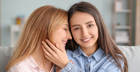 Happy young woman with her mother together at home