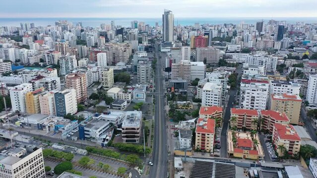 Flying over the city of Santo Domingo national district with the streets alone, no people, no traffic 4k