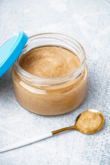 Jar with delicious caviar of capelin on grey background