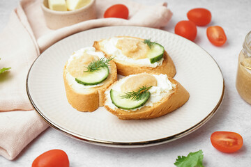 Delicious canapes with caviar of capelin on grey background