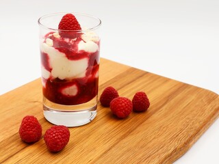 Tasty tiramisu with raspberry coulis. Festive dessert.