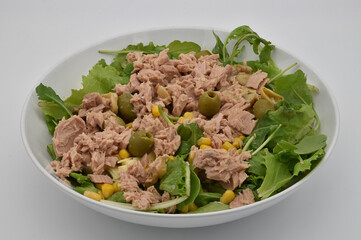 Fresh summer salad with tuna, olives, mais and lattuce.
