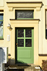 Fototapeta na wymiar View of beautiful building with green wooden door