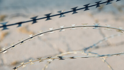 barbed wire fence of iron curtain. Barbed wire - restricted area. barbed wire stretched on the fence.