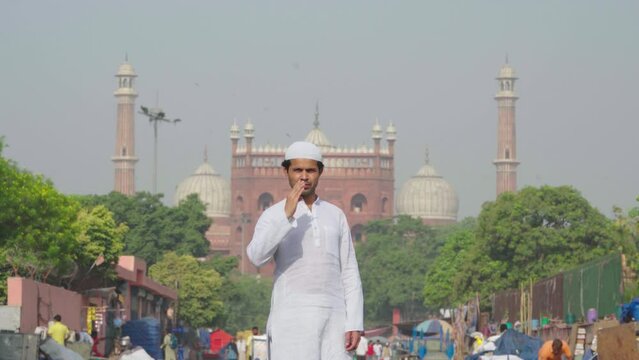 Indian muslim man doing Adab in front of Jama masjid Delhi India