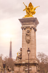 Fototapeta na wymiar View of the Eiffel Tower and the Alexandre III bridge in Paris, France