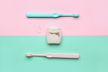 Case with dental floss and toothbrushes on colorful background