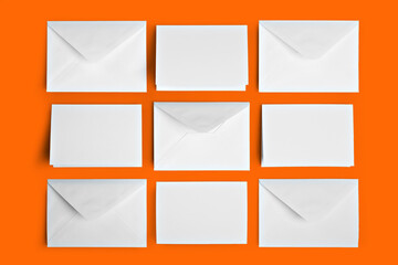 Blank white cards with envelope mockup template orange background