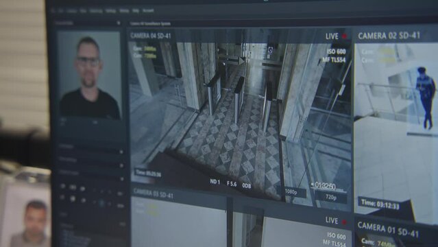 Close up shot of computer screen showing footage of surveillance cameras in coworking office with modern biometric face recognition system. CCTV cameras. High tech security. Concept of social safety.