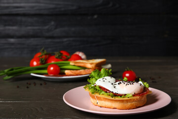 Plate with tasty egg Benedict on table