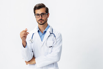 A man doctor in a white coat and eyeglasses seriously on a white isolated background looking into the camera, copy space, space for text, health