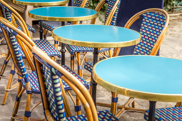 Typical table and chairs in the streets of Paris, France