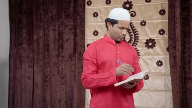 Indian muslim teacher reciting poem to the students