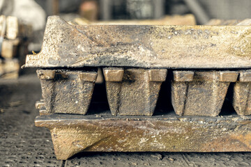 closeup of brass ingot in a pack in a foundry