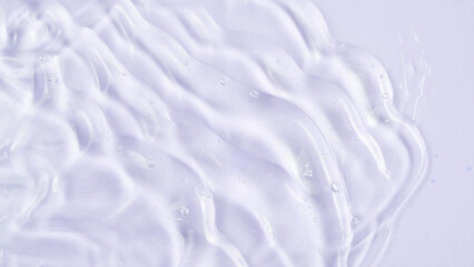 Cosmetic product texture, moisturizing lotion isolated on light lavender background, squeezed out and smeared portion of skincare cream product testing. Macro texture - obrazy, fototapety, plakaty