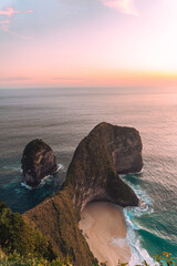Coast at sunset, beautiful cliffs and beach, ocean, Nusa Penida, Indonesia, tropical island.