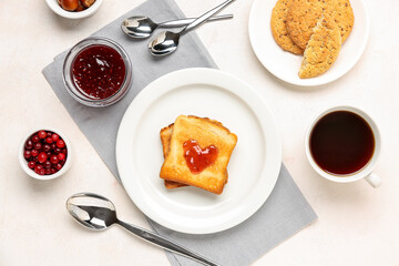 Plate with tasty toasts, cranberry jam, cookies and cup of coffee on light background