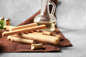 Tasty Italian Grissini on light background