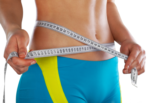 Slim young woman measuring her thin waist with a tape measure, close up
